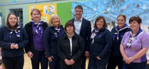 Met Éireann's Mary Curley and Gerry Murphy, centre, with representatives of the Ladybirds, Brownies, and Girl Guides of Clones